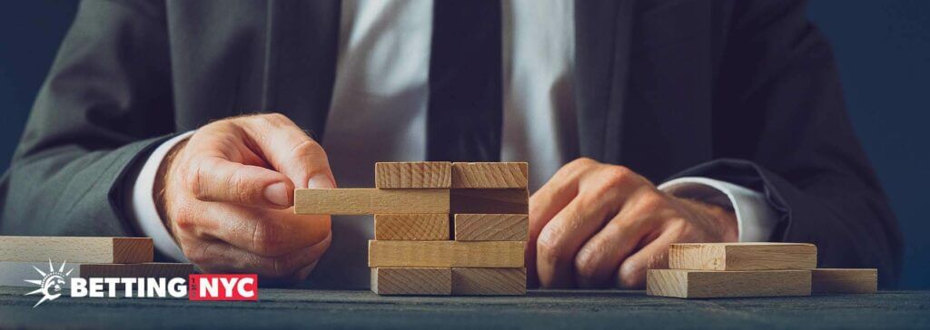 man in suit with building blocks